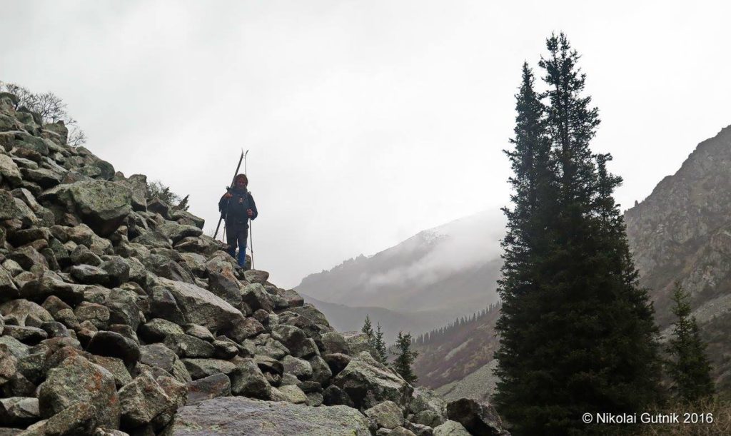 Navigating boulders, scree, and trees. Photo by Nikolai Gutnik.